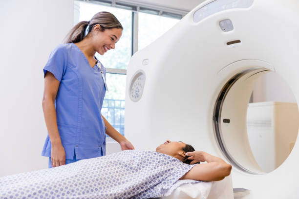Caring radiographer listens to female patient