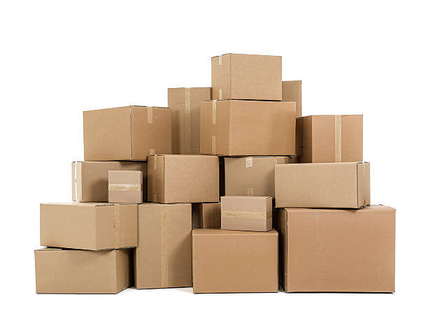 Cardboard boxes Pile of cardboard boxes on white background cardboard box stock pictures, royalty-free photos & images