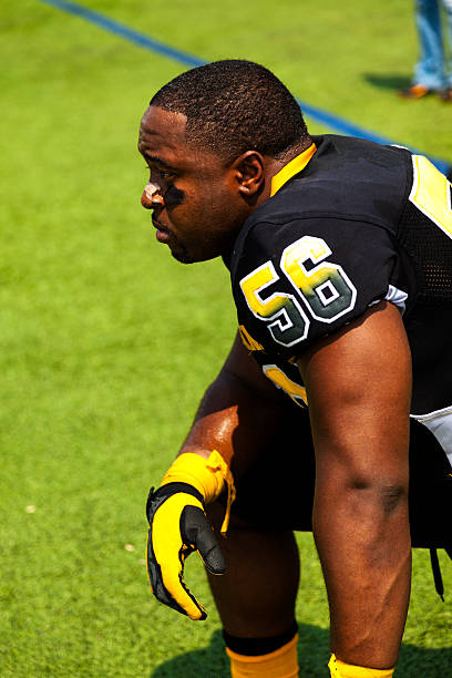 istock Sports: Football player waits on sidelines to reenter game. 187034717
