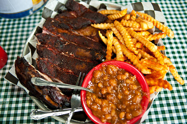 Kansas City barbecue ribs with fries and baked beans stock photo