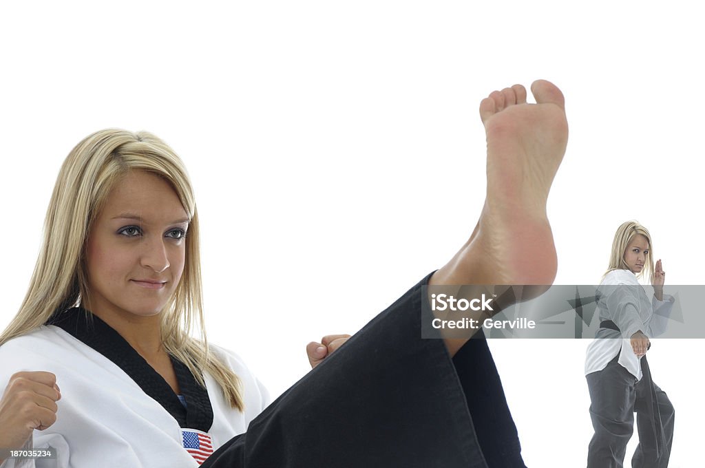 Kick and block Martial artist kicking and blocking. Barefoot Stock Photo