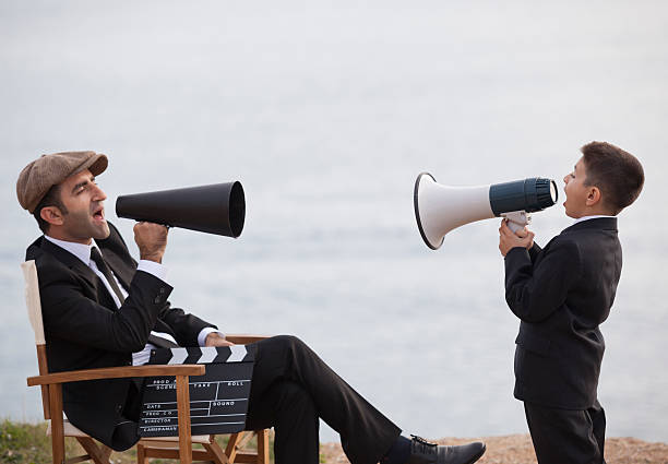 istock Director father and son Shouting With Megaphone 187035248