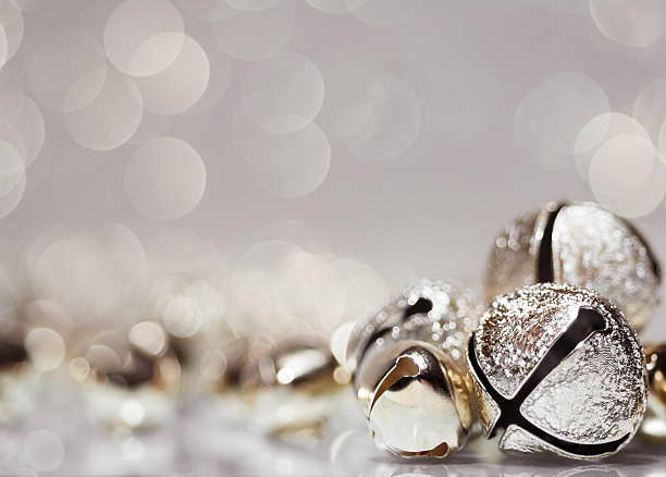 Holiday jingle bell background A stock photo of close-up holiday bells bell photos stock pictures, royalty-free photos & images
