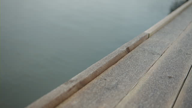 Close-up of a wooden pier, covered in fine frost