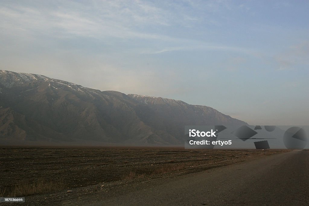 Open landscape Road goes into the distance on an open landscape. Asia Stock Photo