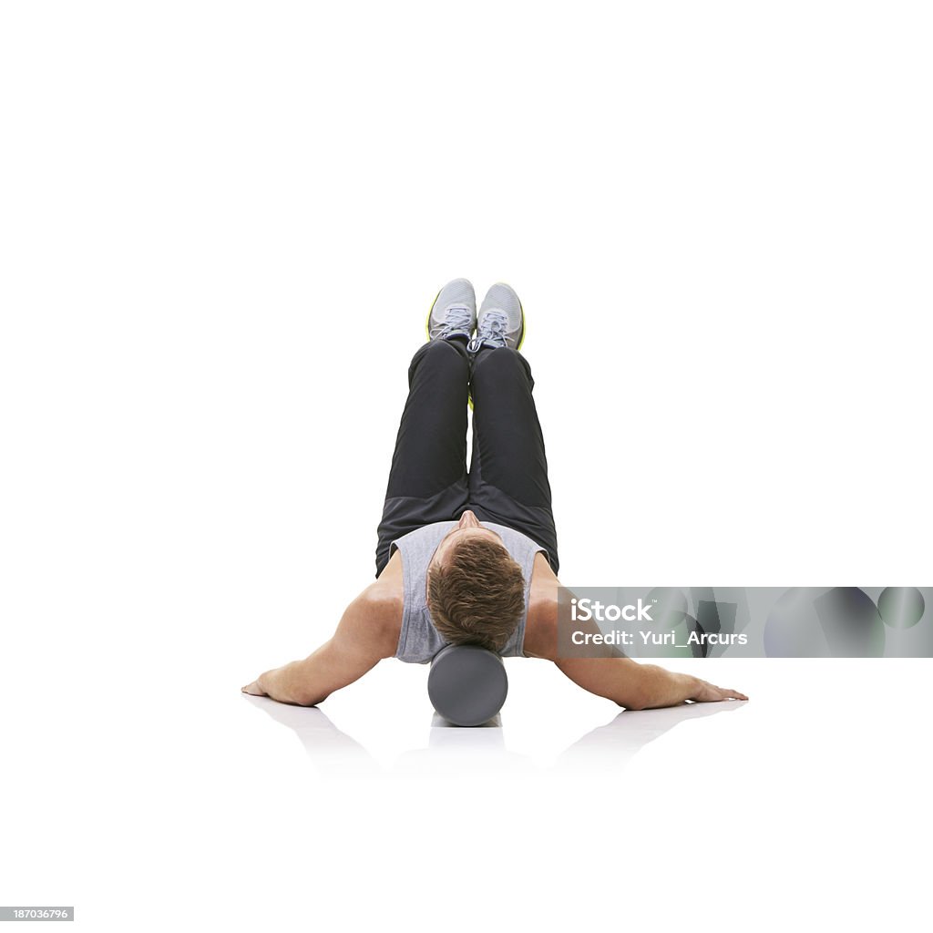 En tenant la position fait la force et l'endurance - Photo de Foam roller libre de droits