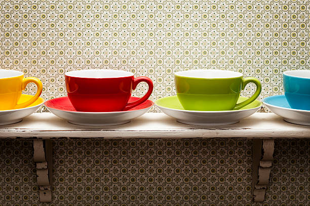 istock Colorful coffee cups on shabby shelf 187037159
