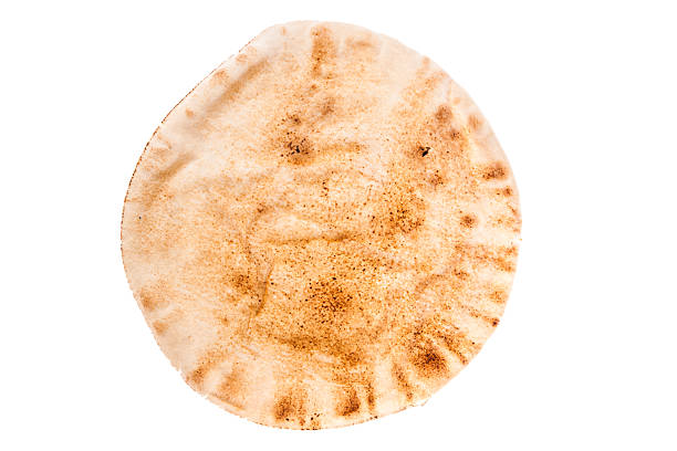 Pita Bread Piece of wheat pita bread on a white background pita bread stock pictures, royalty-free photos & images