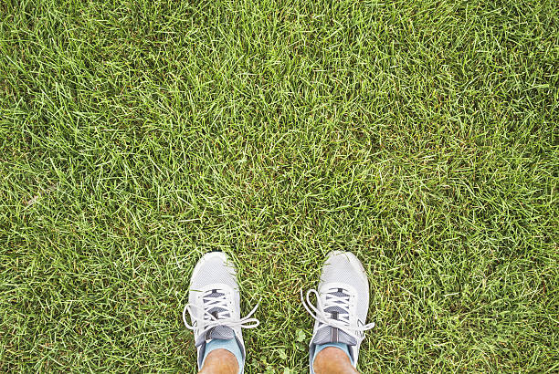 istock Feet On Green Grass 187037983