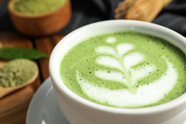 istock Delicious matcha latte in cup on table, closeup 1870381585