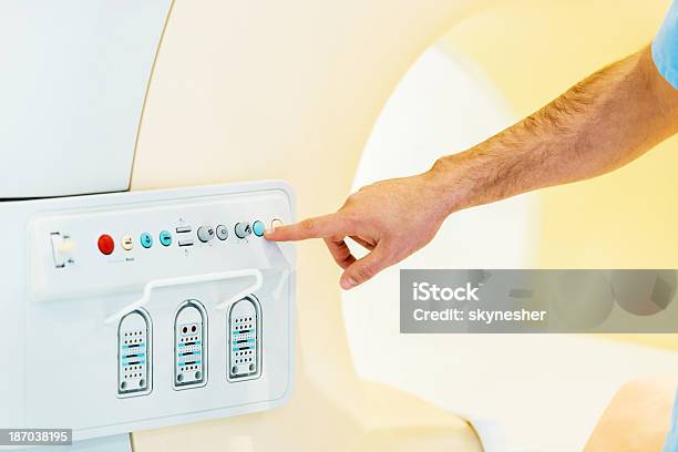 Pressing The Start Button On Mri Scan Stock Photo - Download Image Now - Adult, Adults Only, CAT Scan