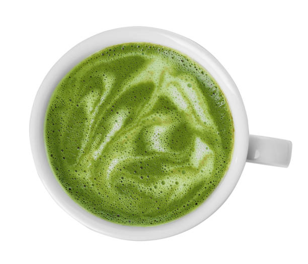 istock Delicious matcha latte in cup on white background, top view 1870382121
