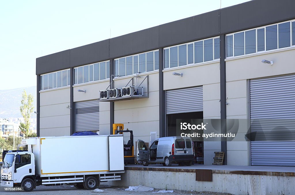 Warehouse building Delivery truck park at the dock. Building Entrance Stock Photo