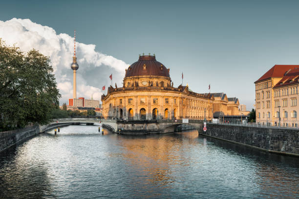 Berlin, Germany - September 03, 2022: People in cafe on a sunny day near Museum Island and spree river