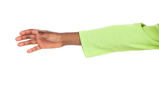 Small african child's hand reaching out. Image is isolated on a white background.