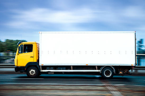 istock Yellow truck on the highway 187039699