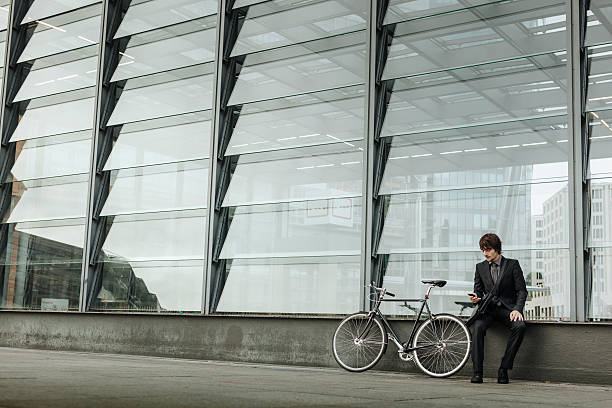 istock Businessman with Bicycle and smartphone 187039752
