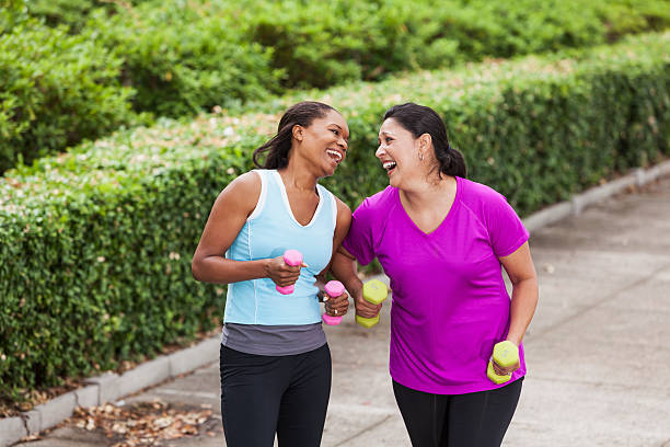 istock Women power walking in park 187040067