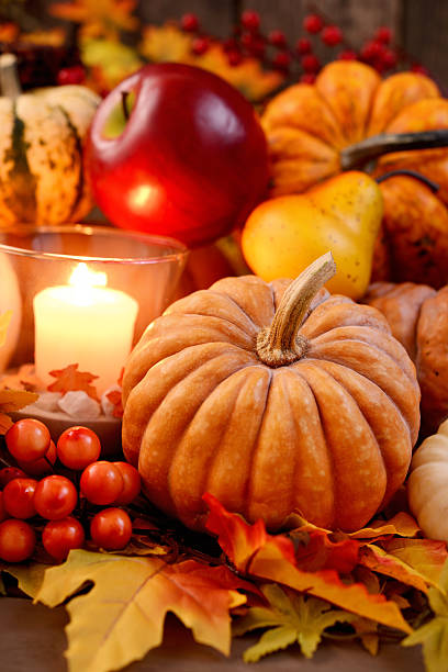 istock Autumn decoration with maple leaves and pumpkins 187040115