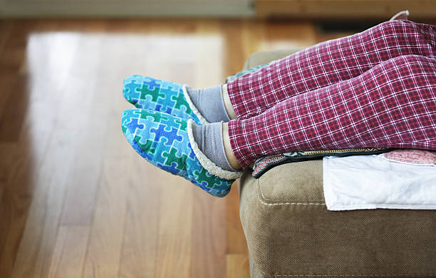 istock Elderly Woman Resting Swollen Feet 187040286