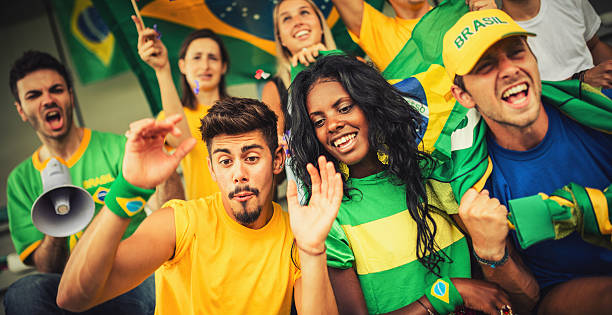 istock Group of brazilian supporters at stadium 187040370