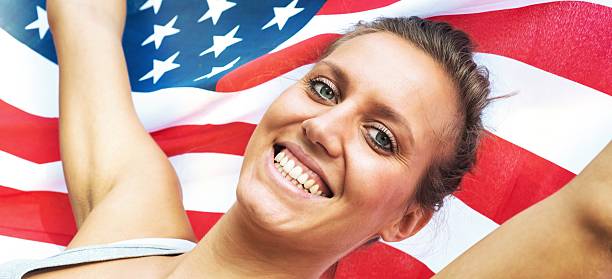 istock Young American Woman with his Flag 187040551