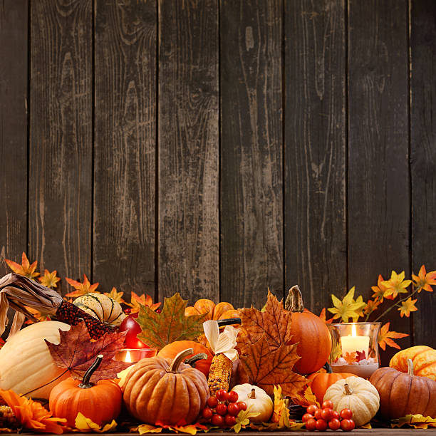 istock Autumn decoration with maple leaves and pumpkins on old woods 187041210