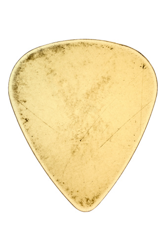 Used clear plastic guitar pick isolated on white with clipping path.
