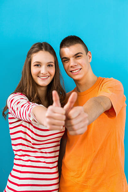 istock Succesfull students showing thumbs up 187041594
