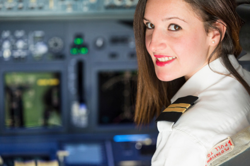 Female Pilot in the Airplane Cockpit
