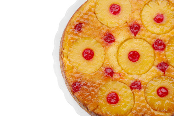 istock Plate with tasty pineapple cake isolated on white, top view 1870423221