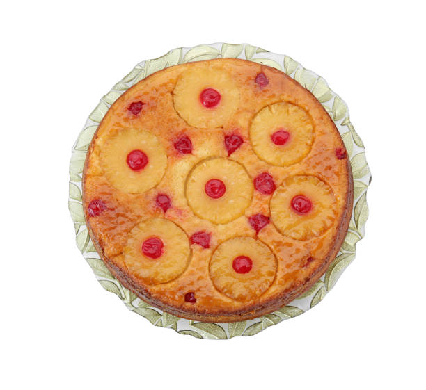 istock Tasty pineapple cake with cherries isolated on white, top view 1870423238