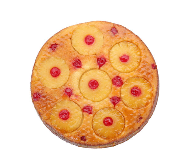 istock Tasty pineapple cake with cherries isolated on white, top view 1870423744