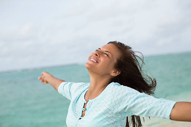 istock Beautiful woman on the beach 187042598