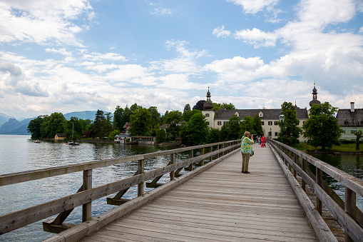 Gmunden , Austria - June 17, 2023: Bridge to Schloss Orth Castle in Gmunden on Traunsee Lake in Austria