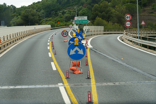 Road signs and markings indicating the direction of movement and the speed of the car on a given section of the road.