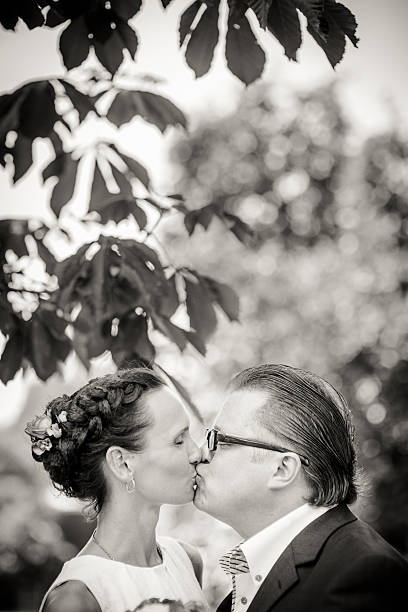 istock Newlyweds kissing 187044439