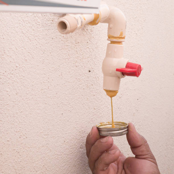 istock A plumber puts glue in a PVC pipe 1870444889