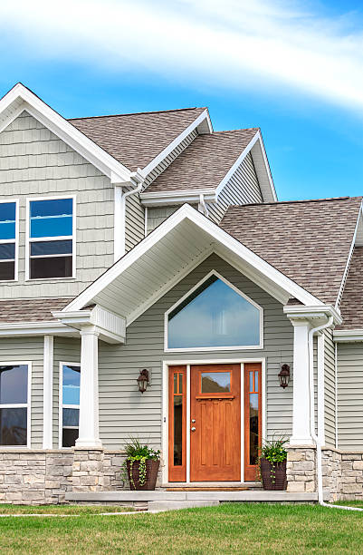 New Construction -Siding, Roof, Gutters, Entry Door stock photo
