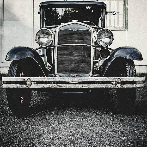 Front View of Model T A front view of an old Ford Model T from the 1920's.  Shot in desaturated vintage style.  Square crop. radiator grille stock pictures, royalty-free photos & images