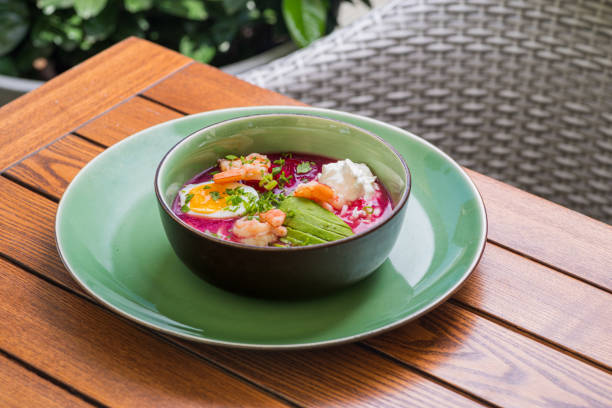 istock Cold beet soup - traditional cold beetroot soup with avocado, shrimps, yogurt, egg. vegetarian summer dish. 1870453791