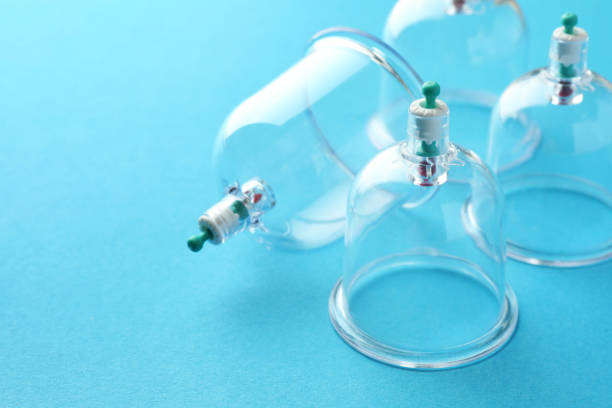 istock Plastic cups on light blue background, closeup with space for text. Cupping therapy 1870455464