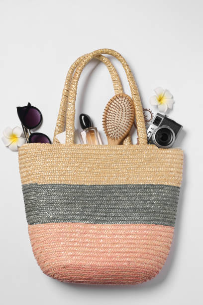 istock Flat lay composition with wicker bag and other beach accessories on white background 1870456510