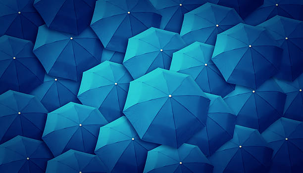 istock A bunch of blue umbrellas tops  187045851