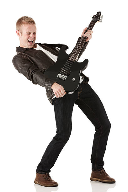 istock Excited young man playing a guitar 187046016