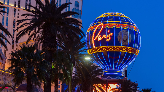 Las Vegas, Nevada - April 2017: Paris sign in Las Vegas. Scenic view of the casinos and resorts. Night view Las Vegas Blvd circa. Nightlife on Las Vegas Strip Boulevard.