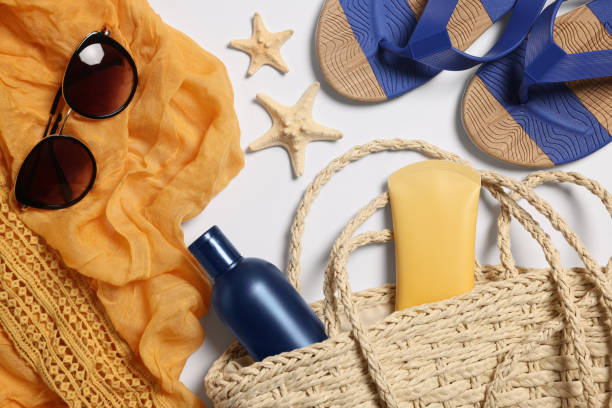 istock Flat lay composition with wicker bag and other beach accessories on white background 1870461254