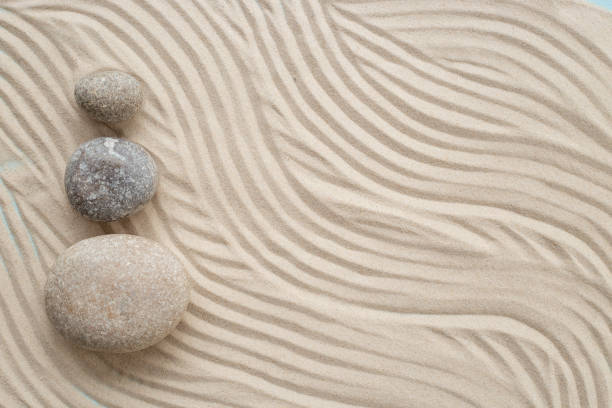 istock Zen garden meditation sandy background with stones for relaxation and hatmony 1870462393