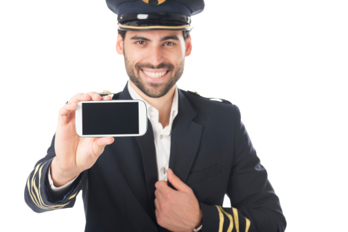 Airplane officer holding a mobile device.