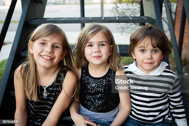 Color Image Of Two Sisters And Their Little Brother Stock Photo - Download Image Now